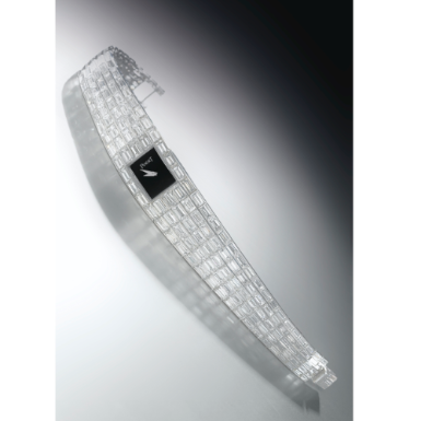 PIAGET - A MAGNIFICENT LADY'S WHITE GOLD AND BAGUETTE-CUT DIAMOND-SET BRACELET WATCH CIRCA 1992 MINI GALAXY