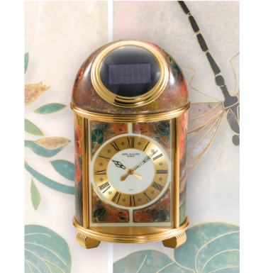 PATEK PHILIPPE - A FINE AND UNIQUE GILT-BRASS SOLAR-POWERED DESK TIMEPIECE WITH CLOISONN