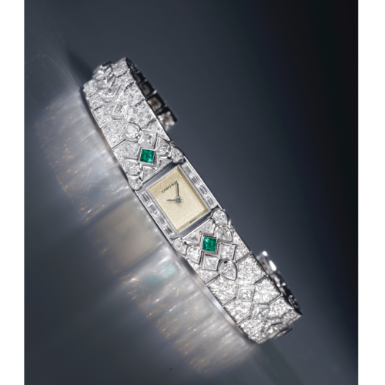 CARTIER - A LADY'S FINE WHITE GOLD, EMERALD AND DIAMOND-SET BRACELET WATCH CIRCA 1990