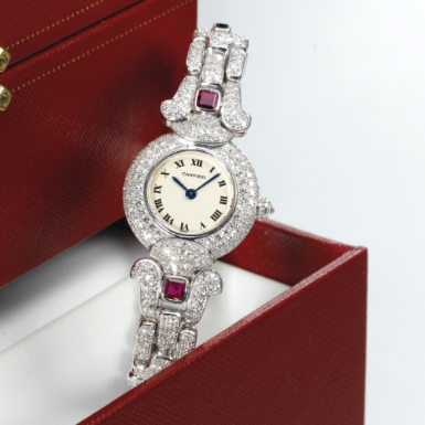 CARTIER - A LADY'S FINE WHITE GOLD, RUBY AND DIAMOND-SET BRACELET WATCH CIRCA 1995