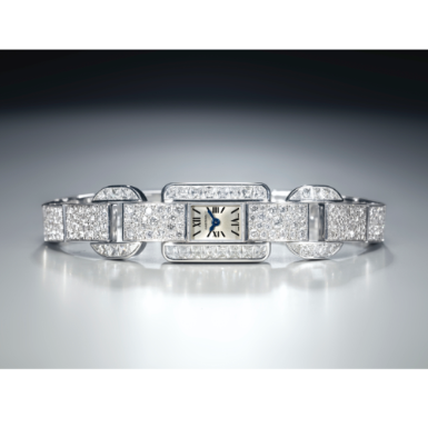 CARTIER - A LADY'S FINE WHITE GOLD AND DIAMOND-SET RECTANGULAR WRISTWATCH WITH BRACELET CIRCA 2011