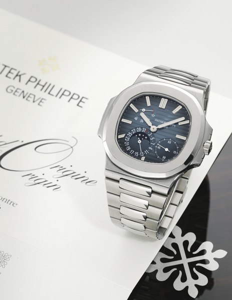 Patek Philippe A STANILESS STEEL AUTOMATIC WRISTWATCH WITH DATE POWER RESERVE MOON-PHASES INDICATION AND BRACELET REF 5712/1A MVT 3173141 CASE 4376214 NAUTILUS MADE IN 2007