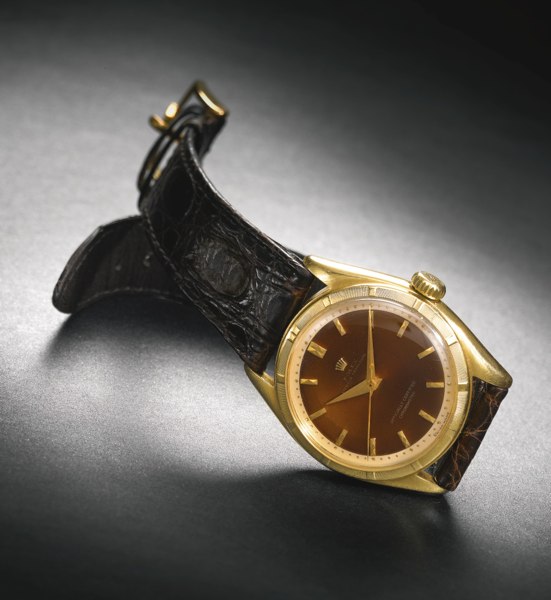 Rolex A RARE 18K YELLOW GOLD CENTER SECONDS WRISTWATCH WITH AMBER-COLORED ENAMEL DIAL CIRCA 1951 REF 6101/6085 MVT 93818 CASE 746250