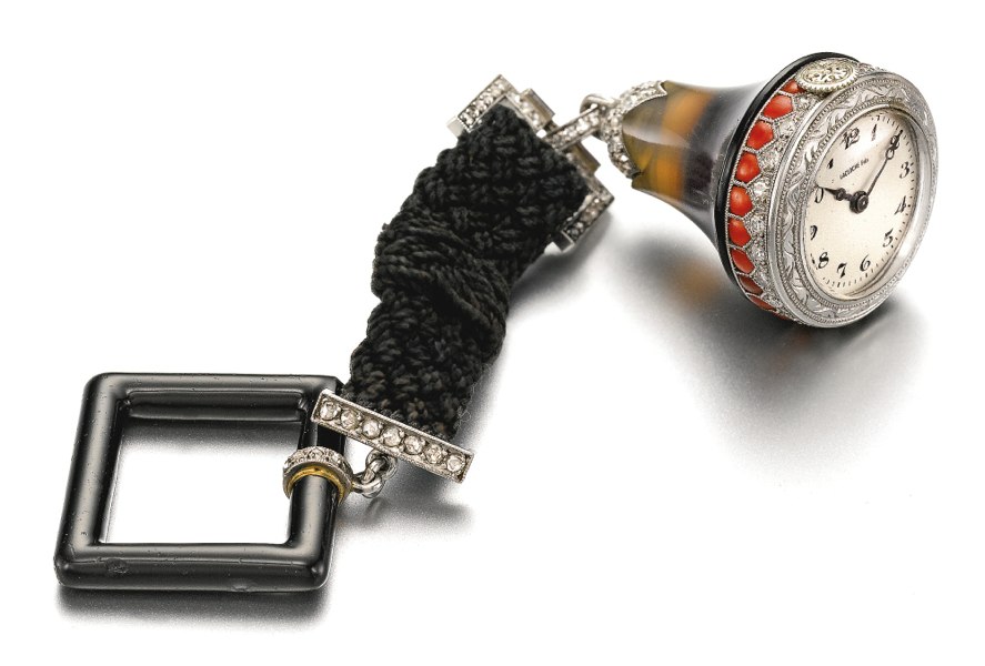 Lacloche Frères A PLATINUM, DIAMOND, CORAL AND AGATE BELL-FORM WATCH CIRCA 1920
