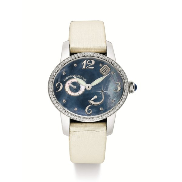 Girard-Perregaux A WHITE GOLD AND DIAMOND-SET OVAL AUTOMATIC WRISTWATCH WITH DATE, POWER RESERVE AND MOTHER-OF-PEARL DIAL CIRCA 2008 NO 469 CAT'S EYE
