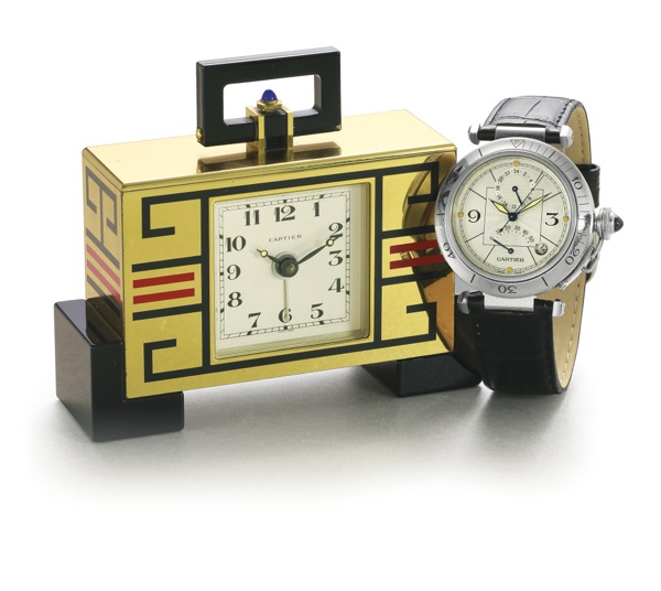 Cartier A LOT OF TWO TIMEPIECES ONE PASHA STAINLESS STEEL AUTOMATIC CENTRE SECONDS TWO TIME ZONE WITH POWER RESERVE REF 2388 CIRCA 1990 AND ONE DESK CLOCK WITH ALARM GILT-BRASS CIRCA 1980