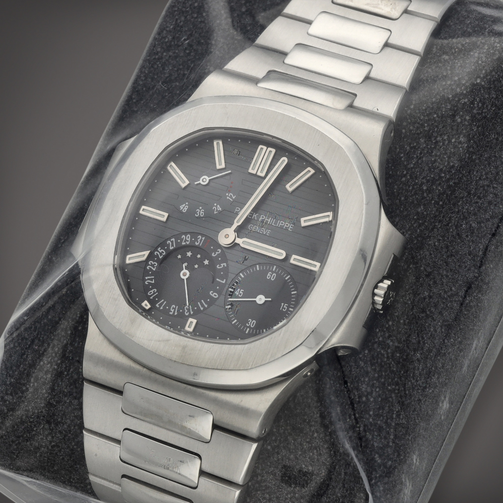 Patek Philippe

Nautilus 'Three Dots', Reference 3712/1A-001 | A factory sealed stainless steel wristwatch with date, moon phases, power reserve indication and bracelet | Circa 2005