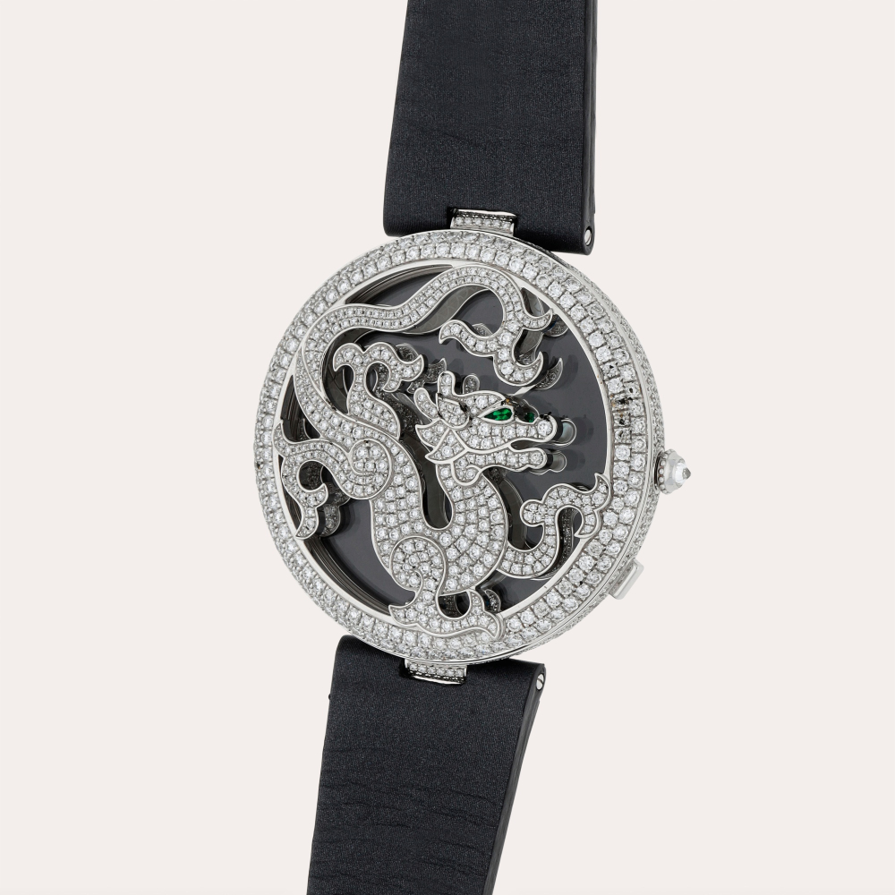Cartier Le Cirque Animalier ‘Dragon’, Reference 3458 | A limited edition white gold, diamond and emerald-set wristwatch with mother-of-pearl, diamond and emerald-set dial | Circa 2012