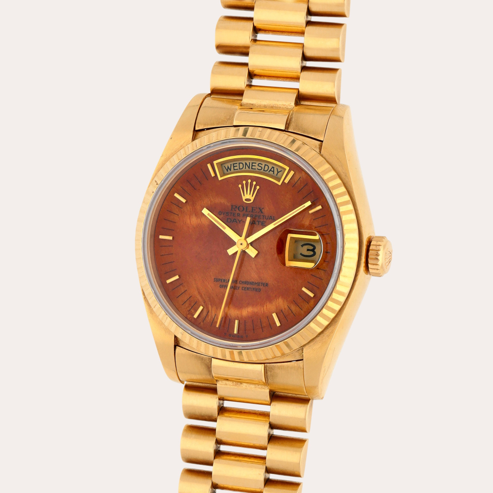 Rolex Day-Date, Reference 18038 | A yellow gold wristwatch with day, date, bracelet and burl wood dial | Circa 1979