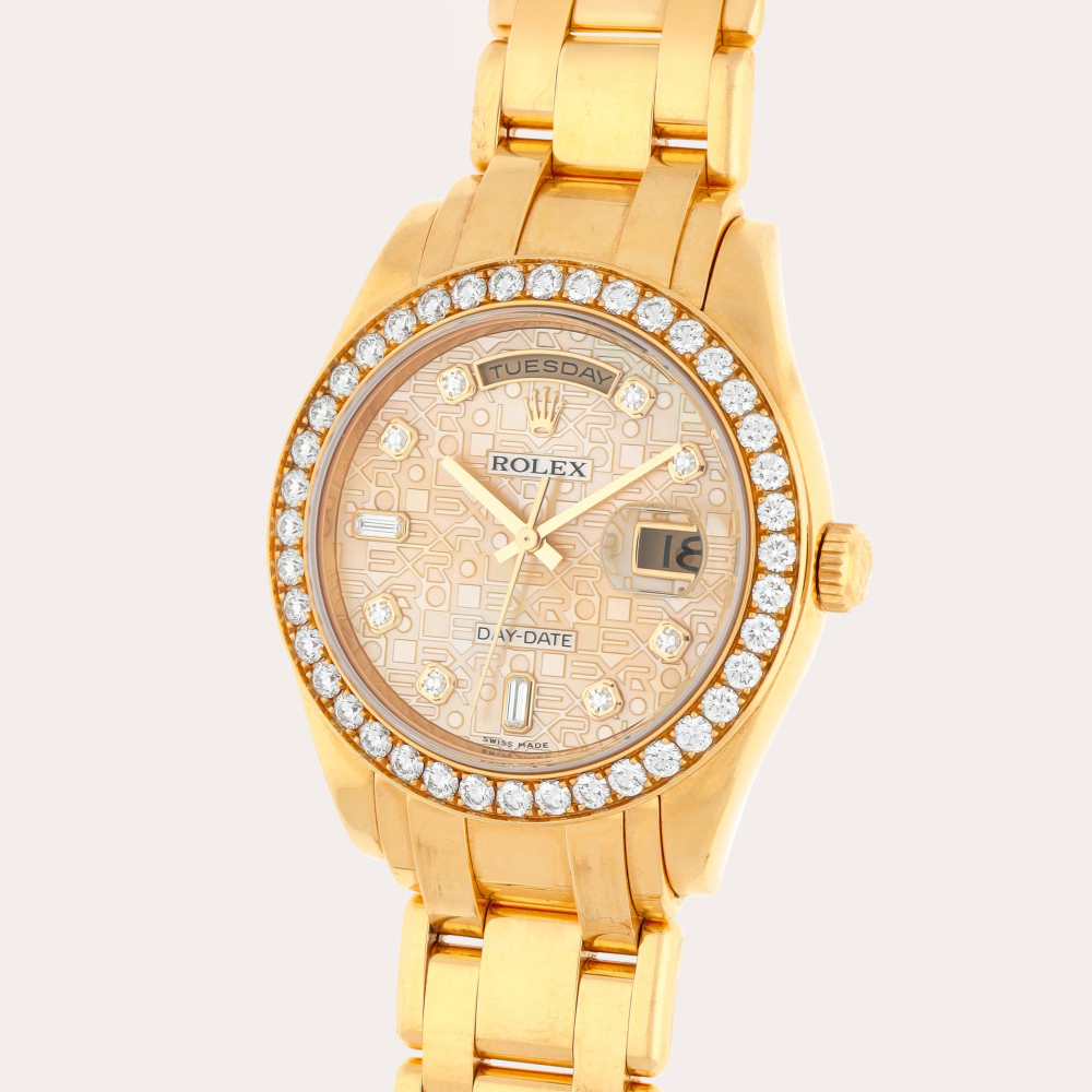Rolex Day-Date Pearlmaster, Reference 18948 | A yellow gold and diamond-set wristwatch with day, date, bracelet and mother-of-pearl and diamond-set dial | Circa 2001