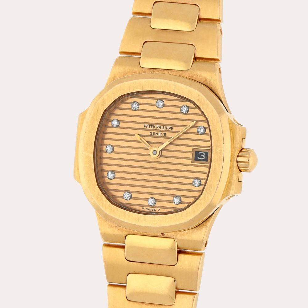 Patek Philippe Nautilus, Reference 4700/1J | A yellow gold and diamond-set wristwatch with date and bracelet | Circa 1987
