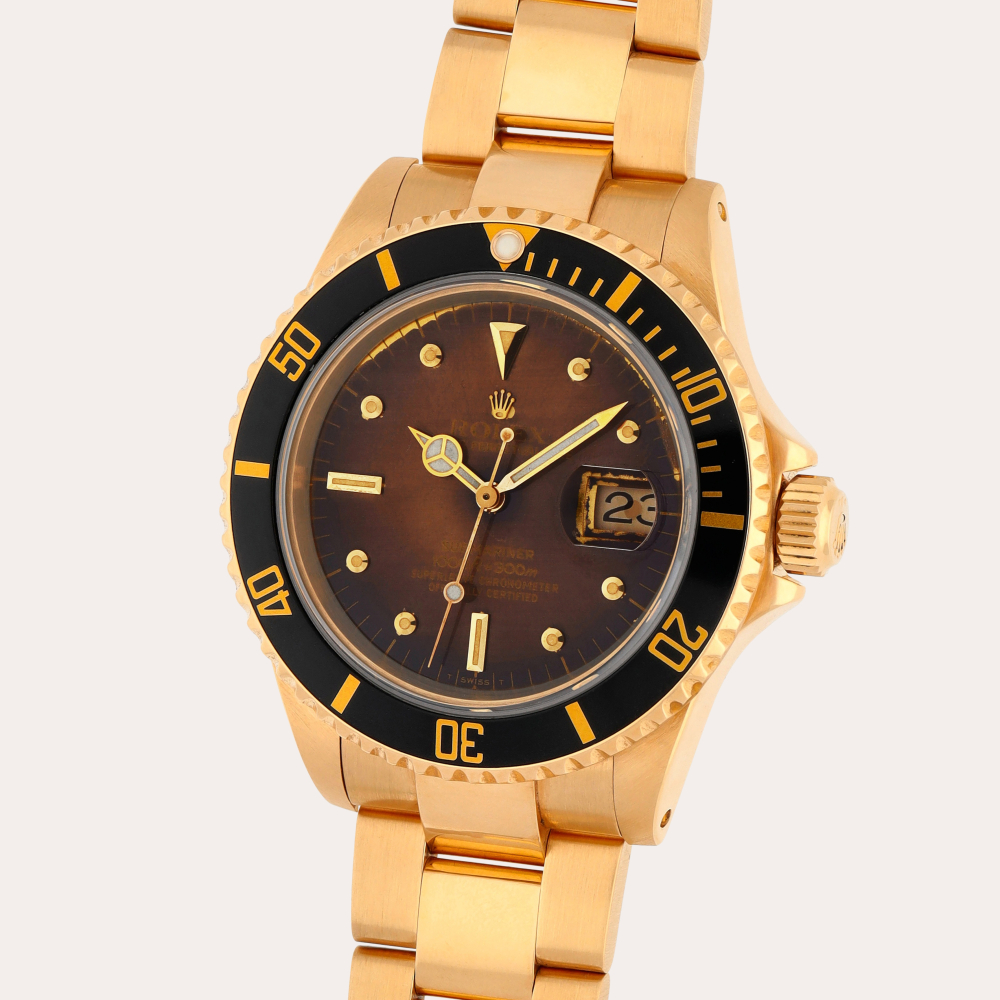 Rolex Submariner 'Nipple Dial', Reference 16808 | A yellow gold wristwatch with date and bracelet | Circa 1981