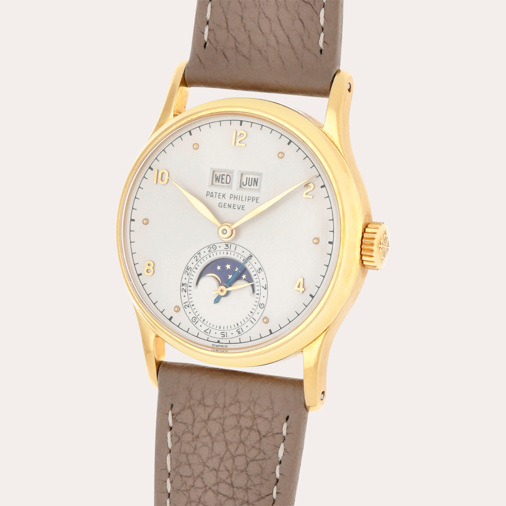 Patek Philippe Reference 1526 | A yellow gold perpetual calendar wristwatch with moon phases | Made in 1946