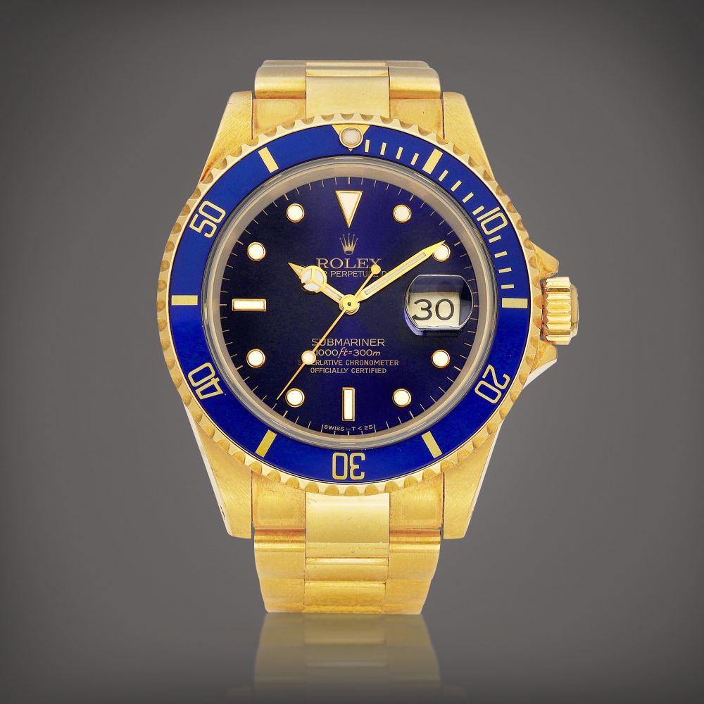 Rolex  Submariner, Reference 16618 A yellow gold wristwatch with date and bracelet, Circa 1991 