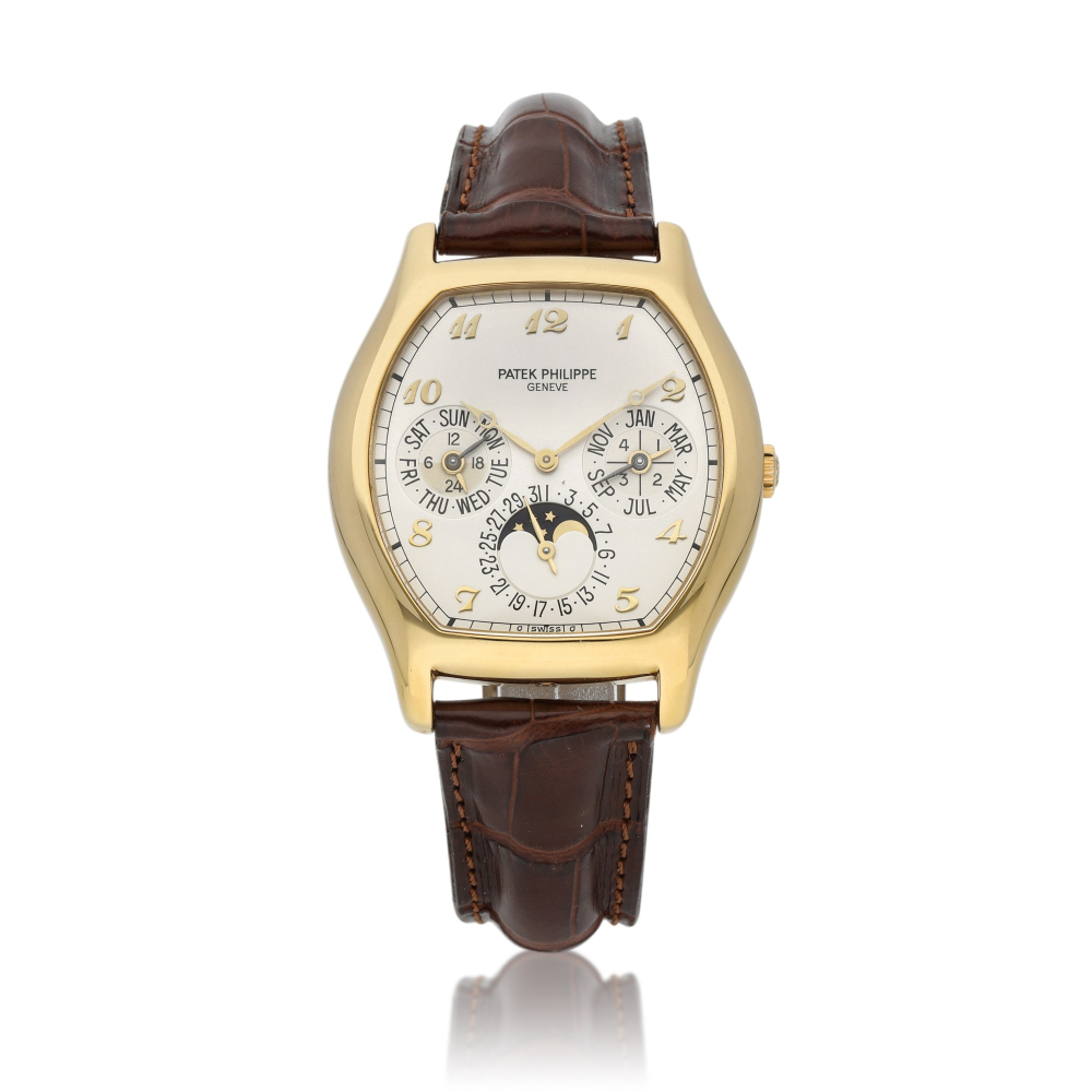Ref. 5040 | A yellow gold tonneau-shaped perpetual calendar wristwatch with moon phases and 24-hour indication | Circa 1997