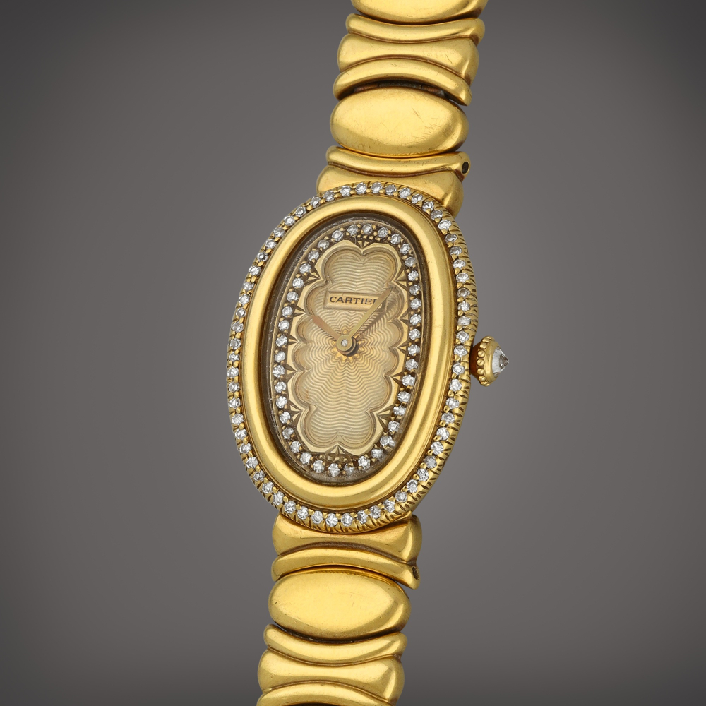 Cartier Baignoire | A yellow gold and diamond-set watch with bracelet | Circa 1990