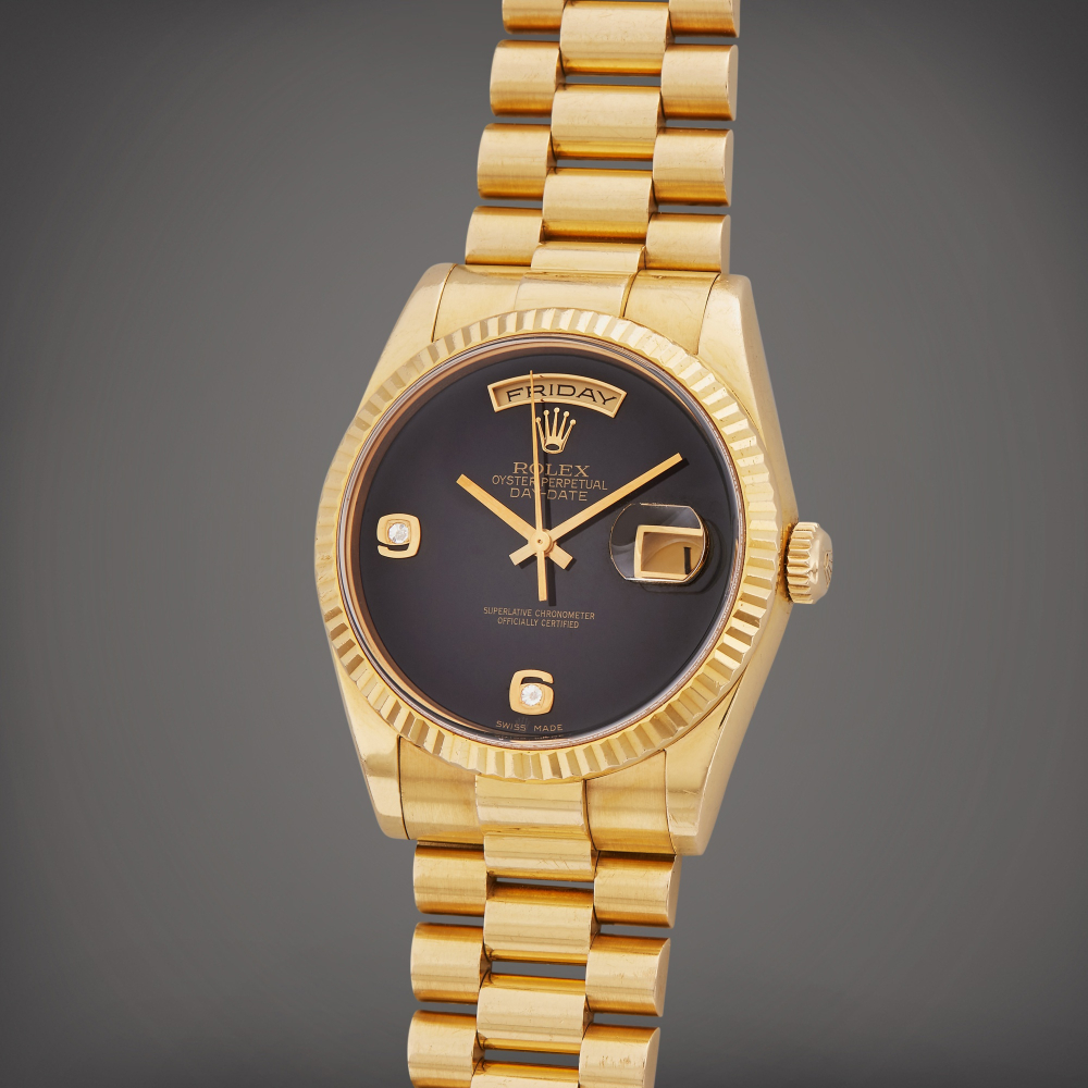 Reference 118238 Day-Date | A yellow gold automatic wristwatch with day, date, bracelet, and onyx dial, Circa 2000