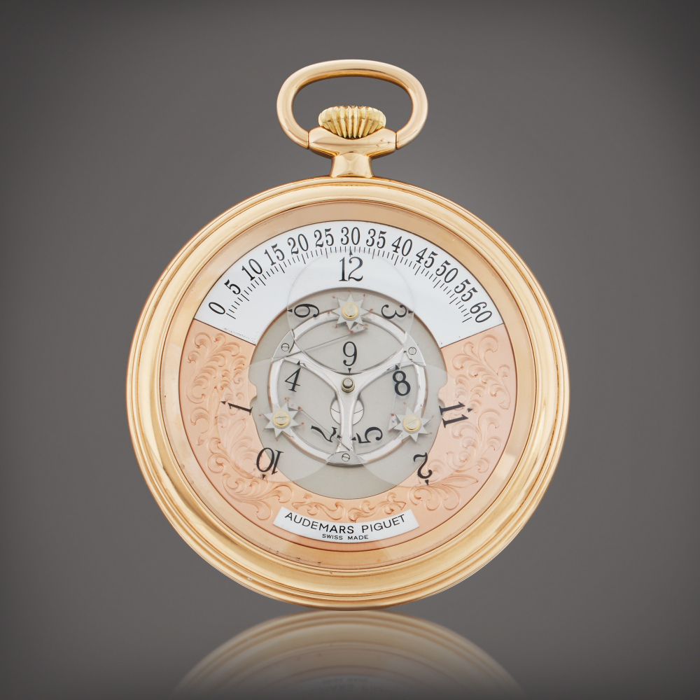 Star Wheel | A pink gold open faced semi-skeletonized wristwatch with satellite hour display, Circa 1995