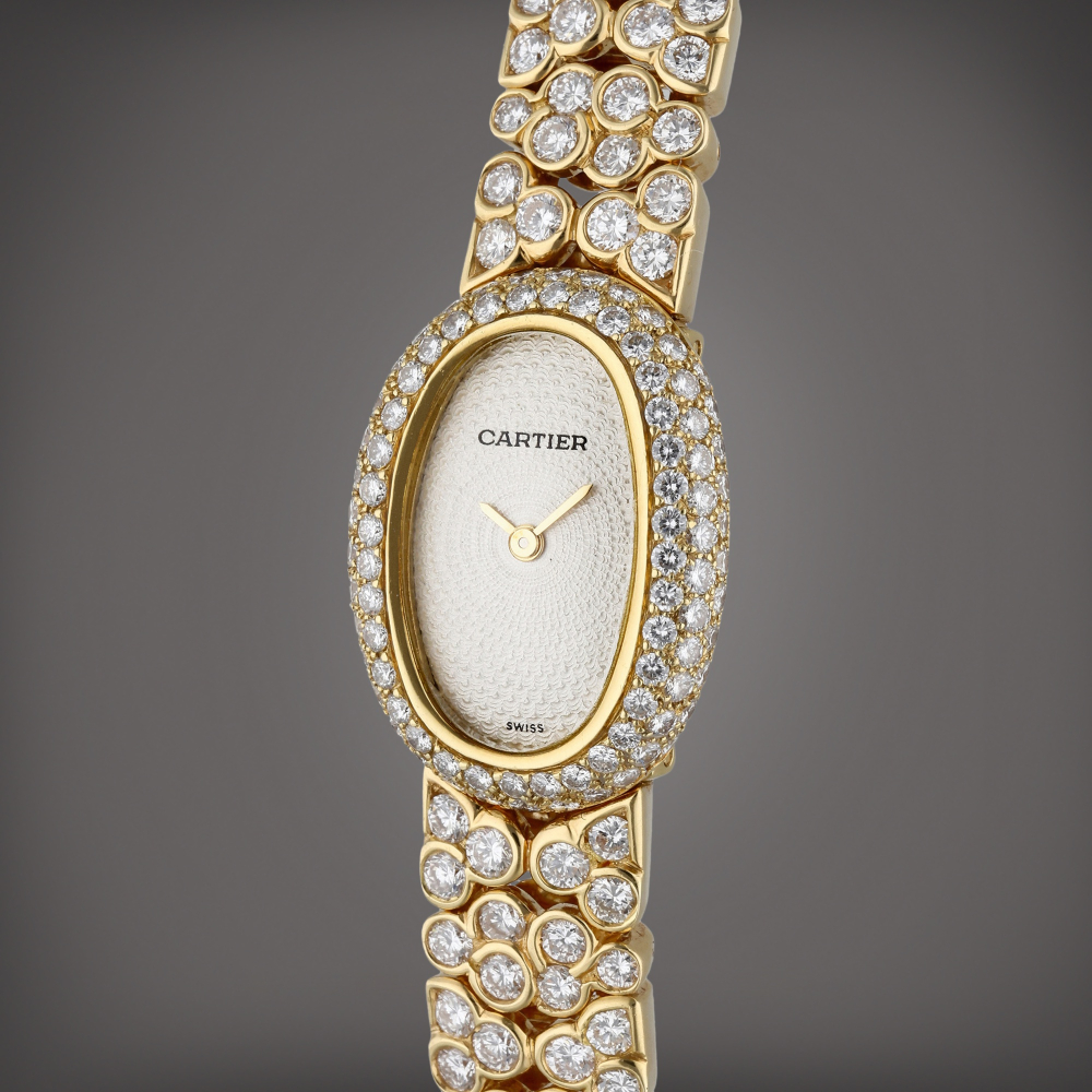 Cartier Baignoire | A yellow gold and diamond-set wristwatch with bracelet, Circa 2005