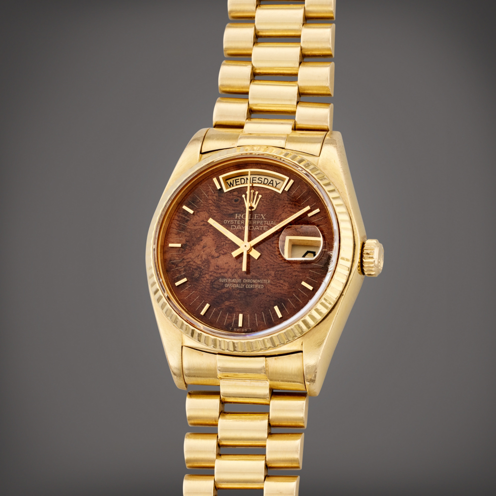 Rolex Reference 18078 Day Date | A yellow gold automatic wristwatch with day, date, bracelet, and burlwood dial, Circa 1979