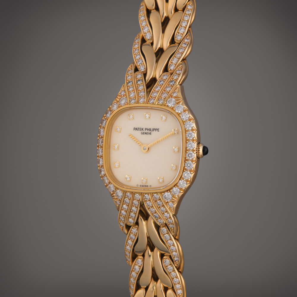 Patek Philippe Reference 4815/3J La Flamme | A yellow gold and diamond-set cushion shaped bracelet watch, Circa 2000