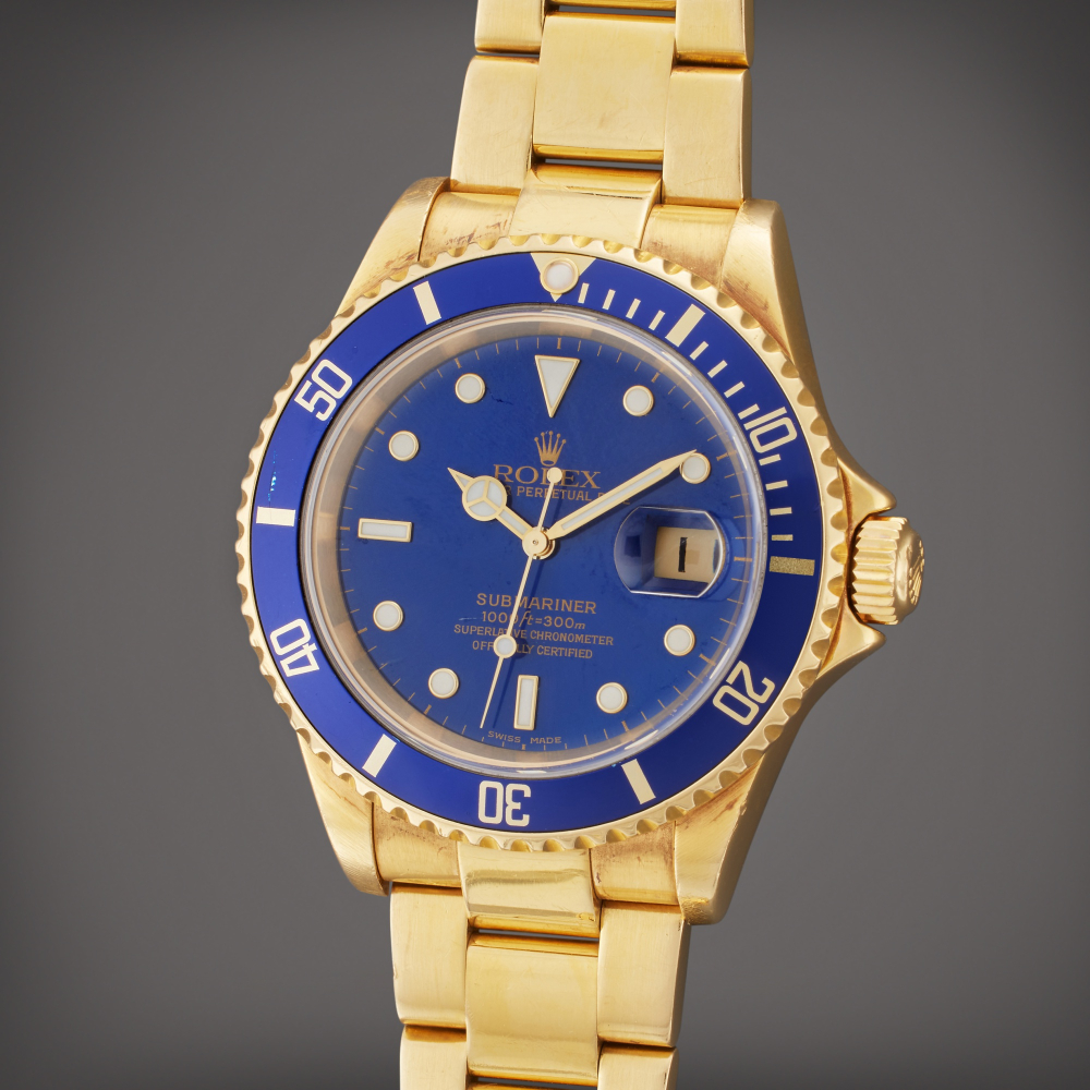 Rolex Reference 16618 T Submariner | A yellow gold automatic wristwatch with date and bracelet, Circa 2003