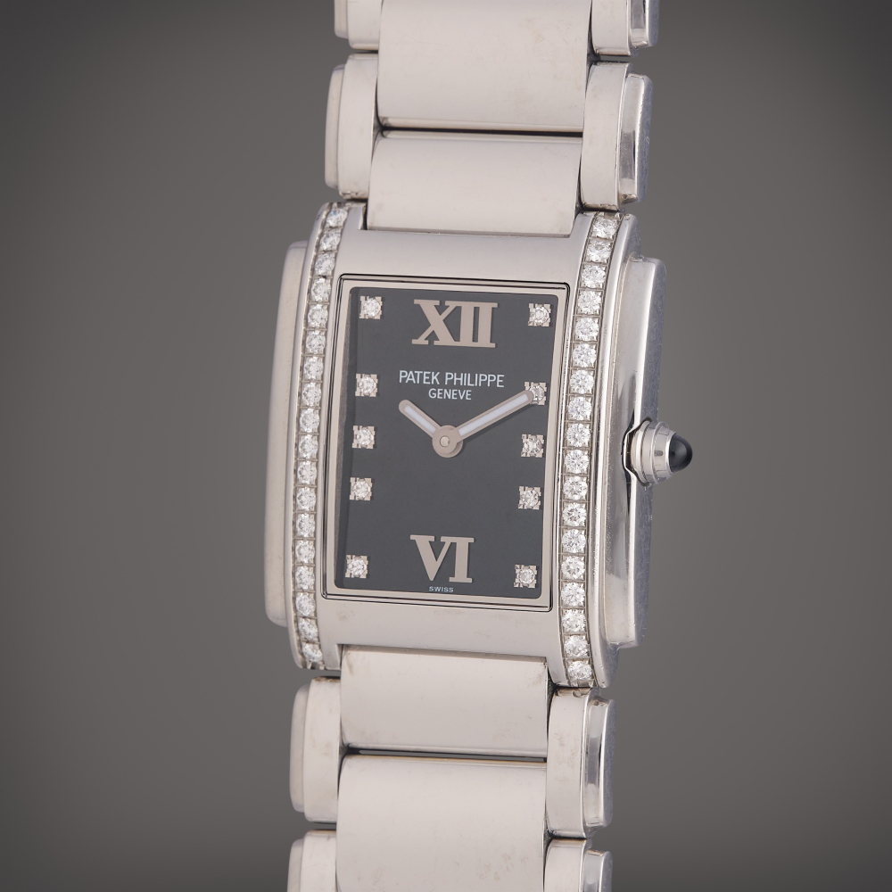 Patek Philippe Reference 4910/10A-001 Twenty-4 | A stainless steel and diamond-set wristwatch with bracelet, Circa 2007