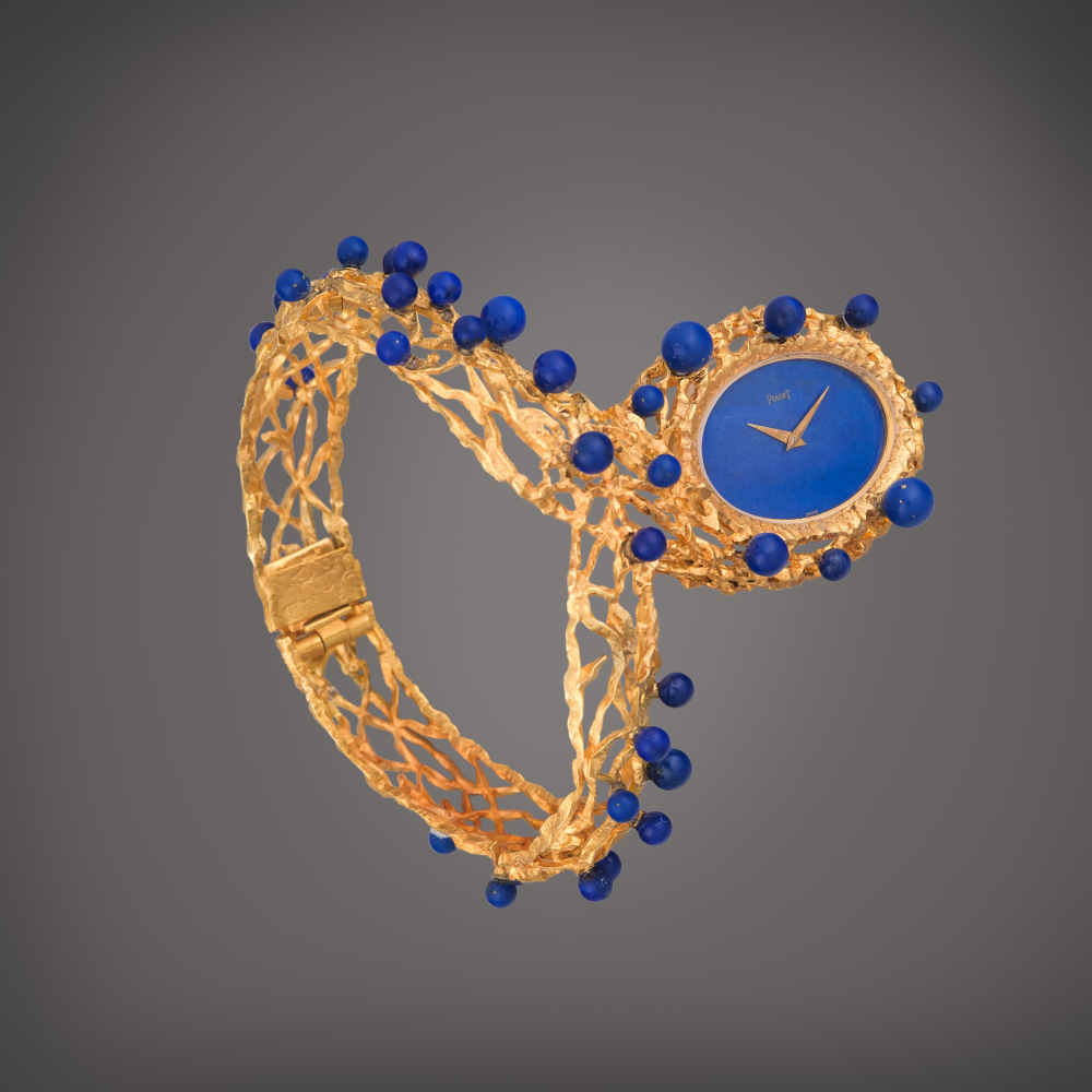 Piaget Reference 9850 | A rare yellow gold openwork bracelet watch with lapis lazuli dial and beads, Circa 1970