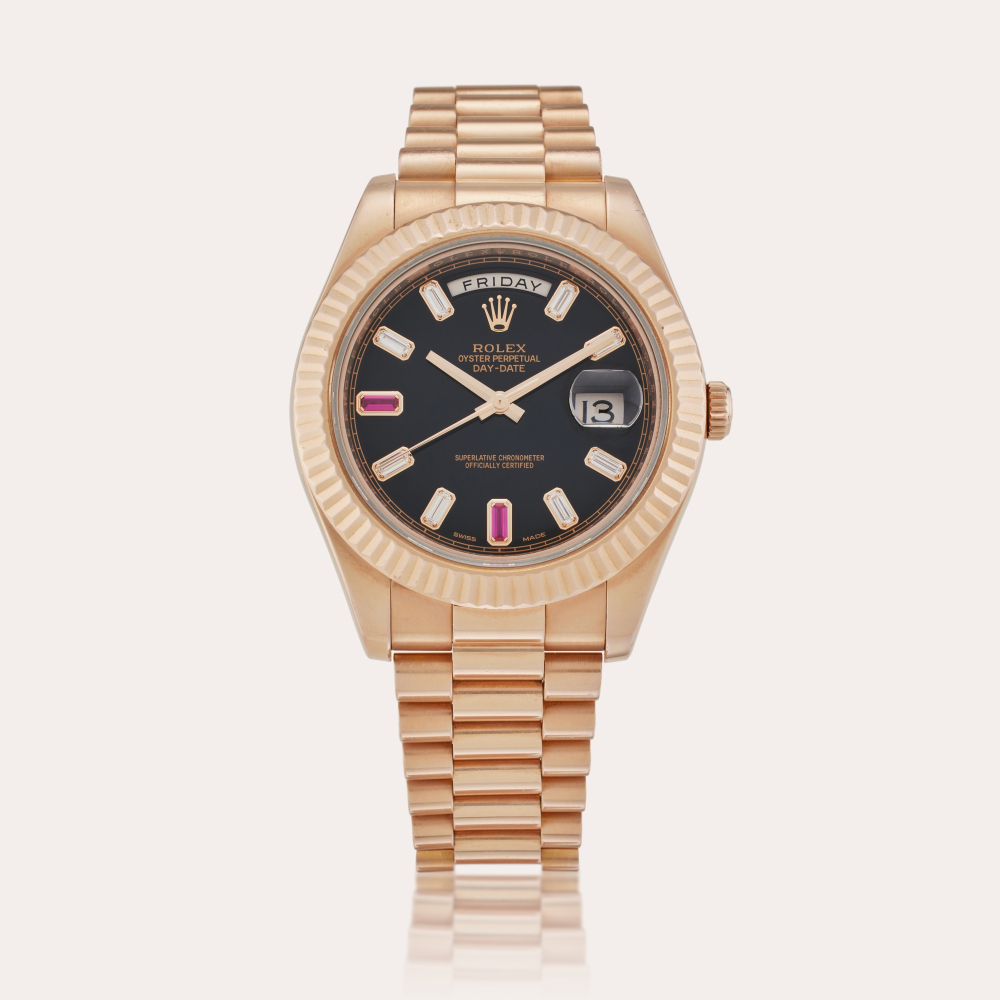 Rolex Reference 218235 Day-Date II | A pink gold, ruby and diamond-set automatic wristwatch with day, date and bracelet, Circa 2015