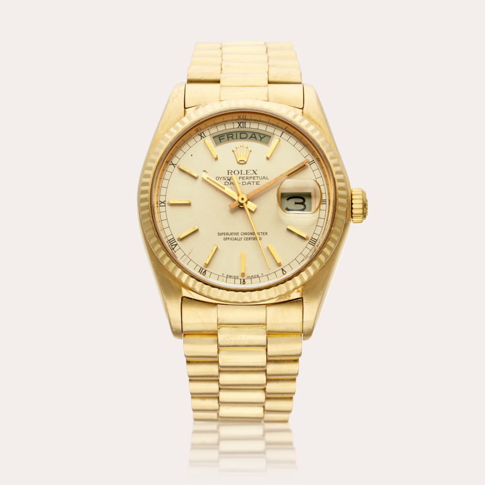 Rolex Reference 18038 Day-Date | A yellow gold automatic wristwatch with day, date, and bracelet, Circa 1978