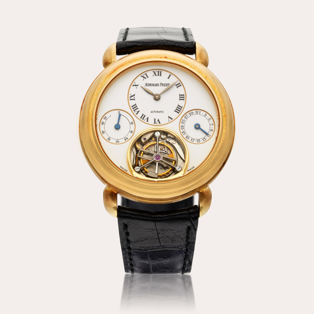 Audemars Piguet Jules Audemars | A yellow gold semi-skeletonized automatic tourbillon wristwatch with power reserve indication and date, Circa 1990