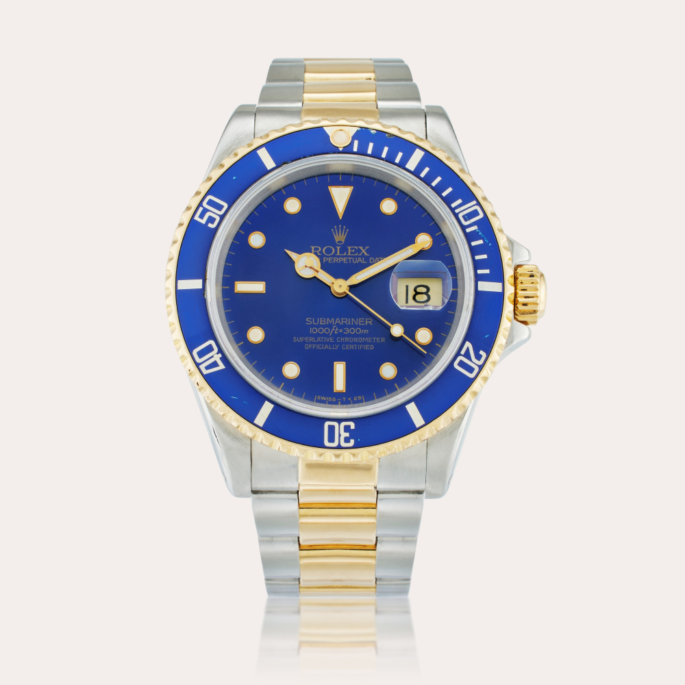 Rolex Reference 16613 Submariner | A yellow gold and stainless steel automatic wristwatch with date and bracelet, Circa 1990