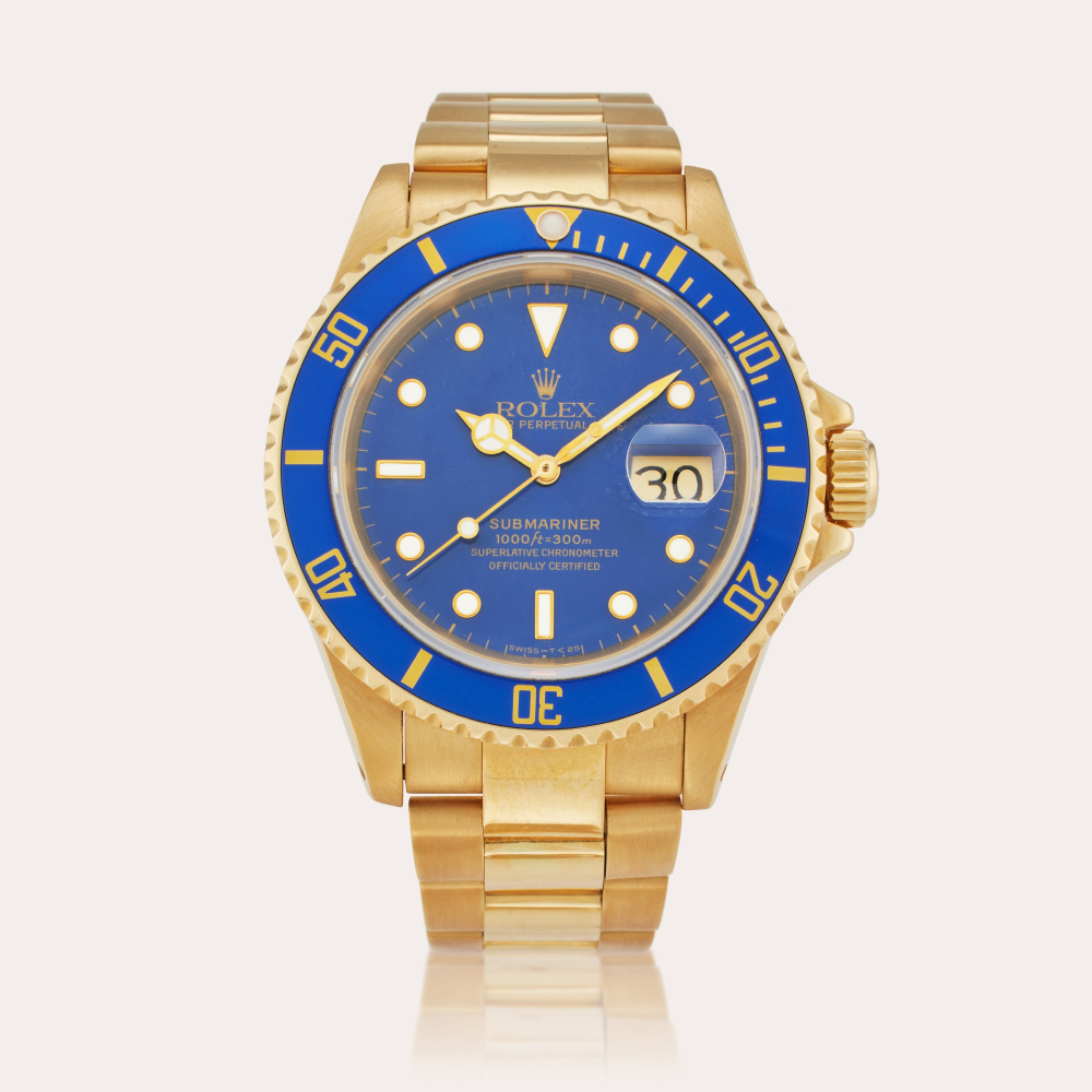 Rolex Reference 16618 Submariner | A yellow gold automatic wristwatch with date and bracelet, Circa 1991