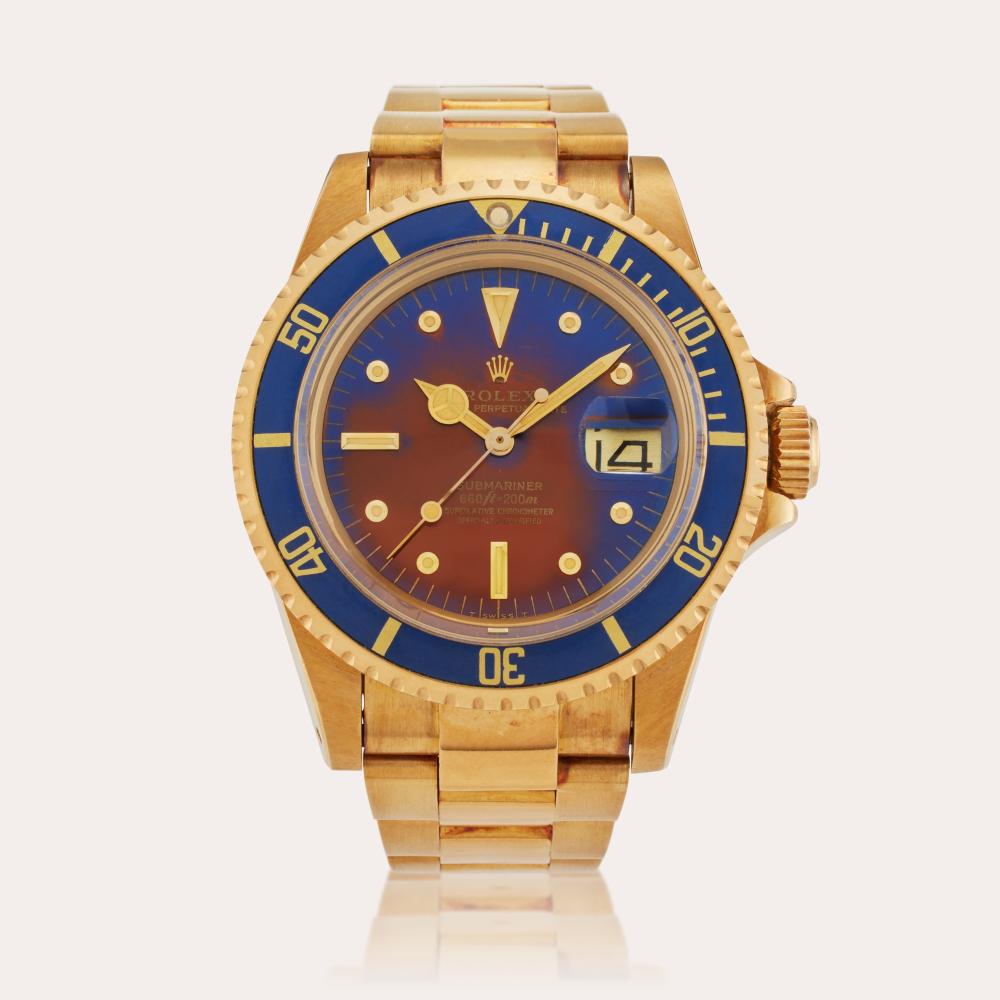 Rolex Reference 1680 Submariner | A yellow gold automatic wristwatch with date, bracelet, and tropical nipple dial, Circa 1978