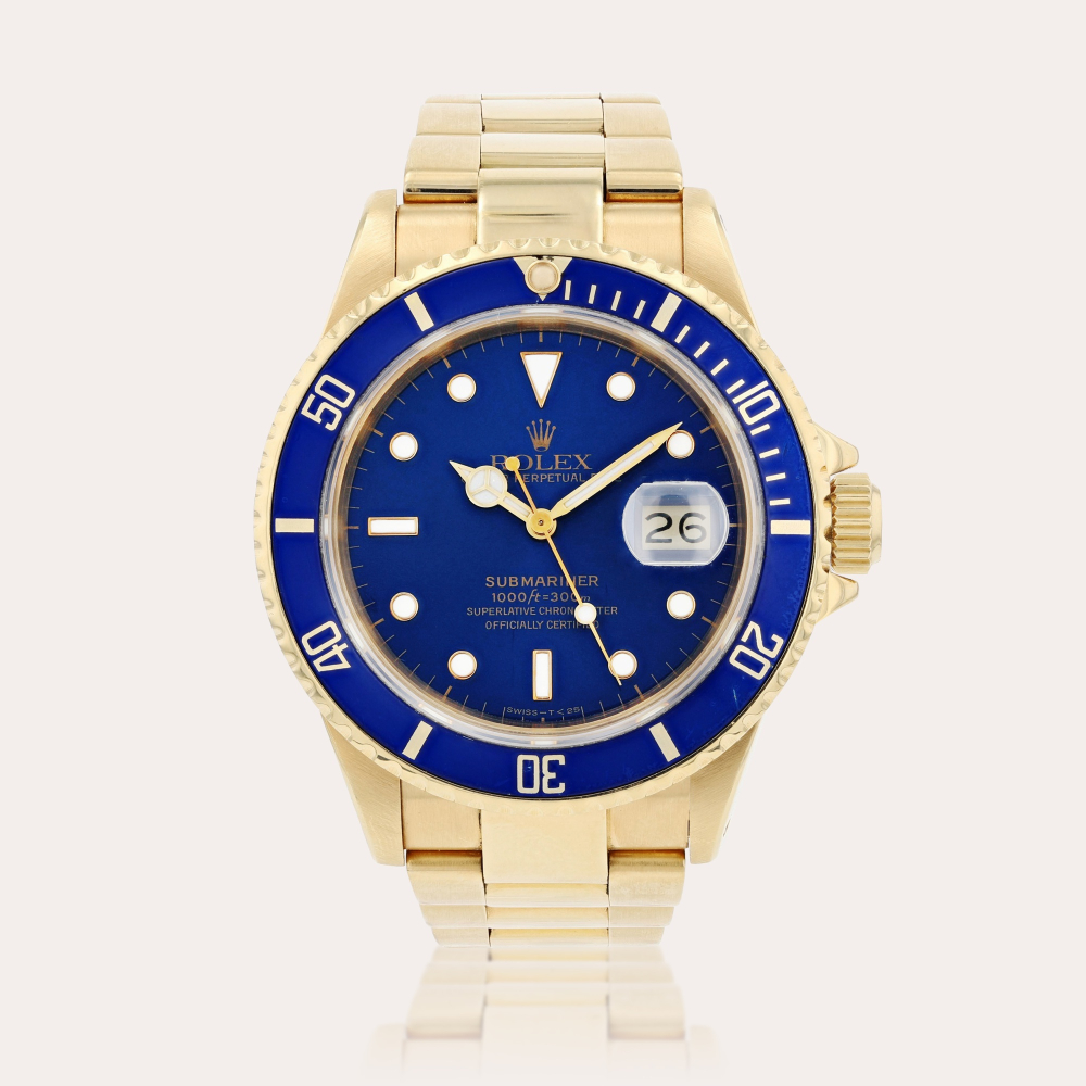 RolexSubmariner, reference 16808 Montre bracelet en or jaune avec date | Yellow gold wristwatch with date and bracelet Vers 1987 | Circa 1987