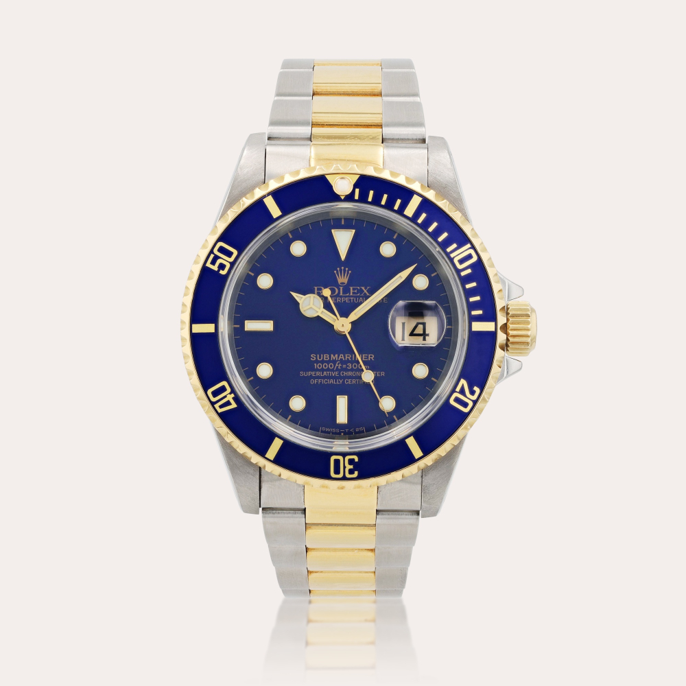 RolexSubmariner, reference 16613 Montre bracelet en acier et or jaune avec date | Stainless steel and yellow gold wristwatch with date and bracelet Vers 1997 | Circa 1997